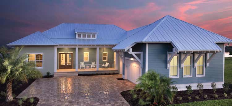 Model home with large backyard and blue exterior at Lake Babcock